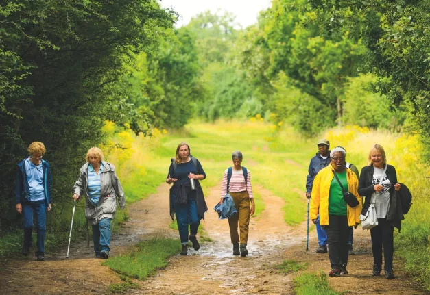 Several people walking as part of Waltham Forest Wanders