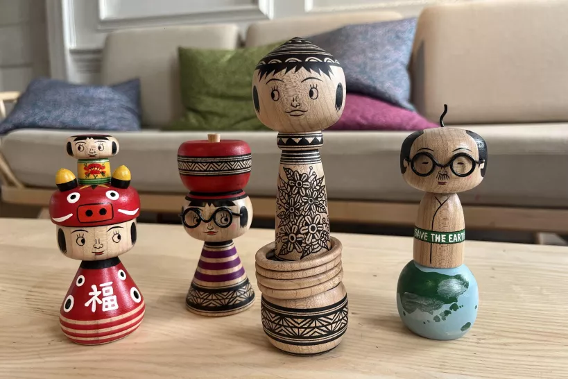 4 hand carved wooden Japanese dolls