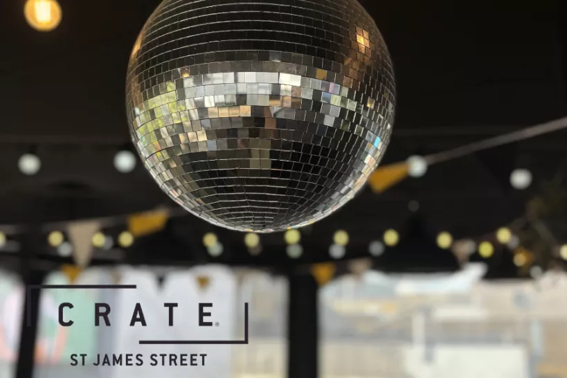 Image of mirror ball with Crate St James Street logo over the top 