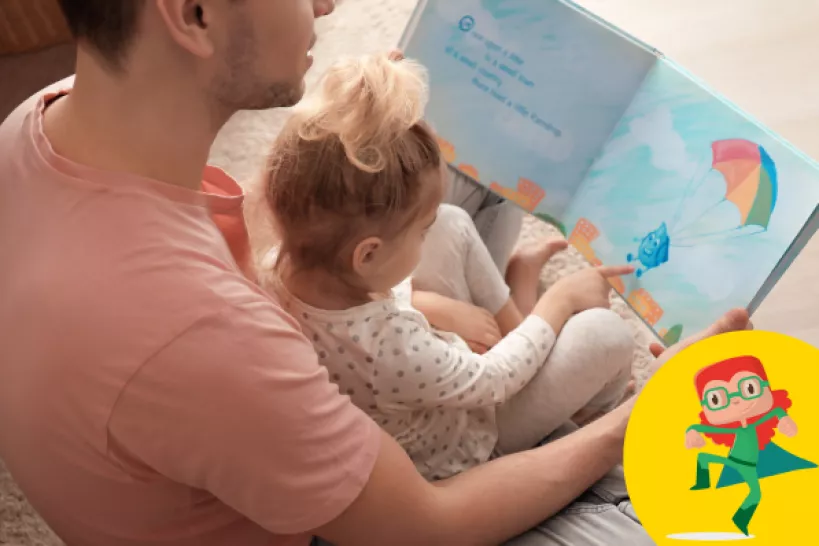 Parent reading a book with a child